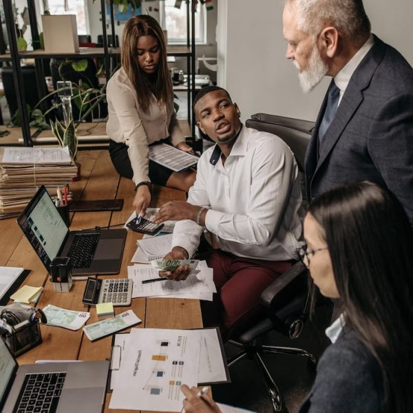 business-people-group-walking-modern-bright-office-interior_931065-2341