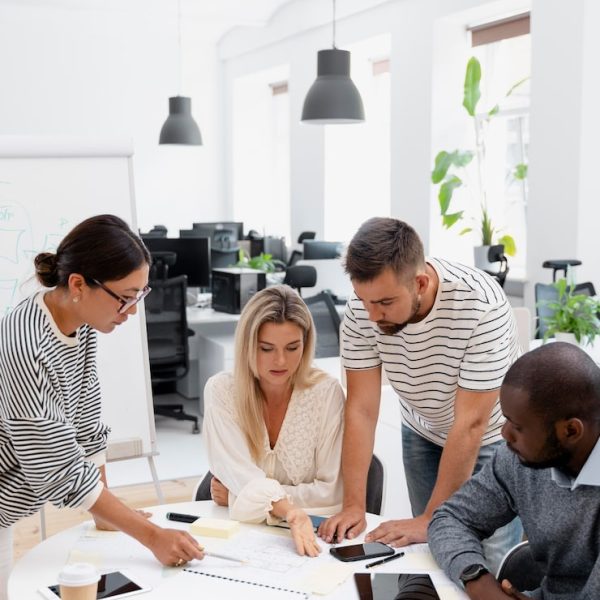 close-up-young-colleagues-having-meeting_23-2149060289